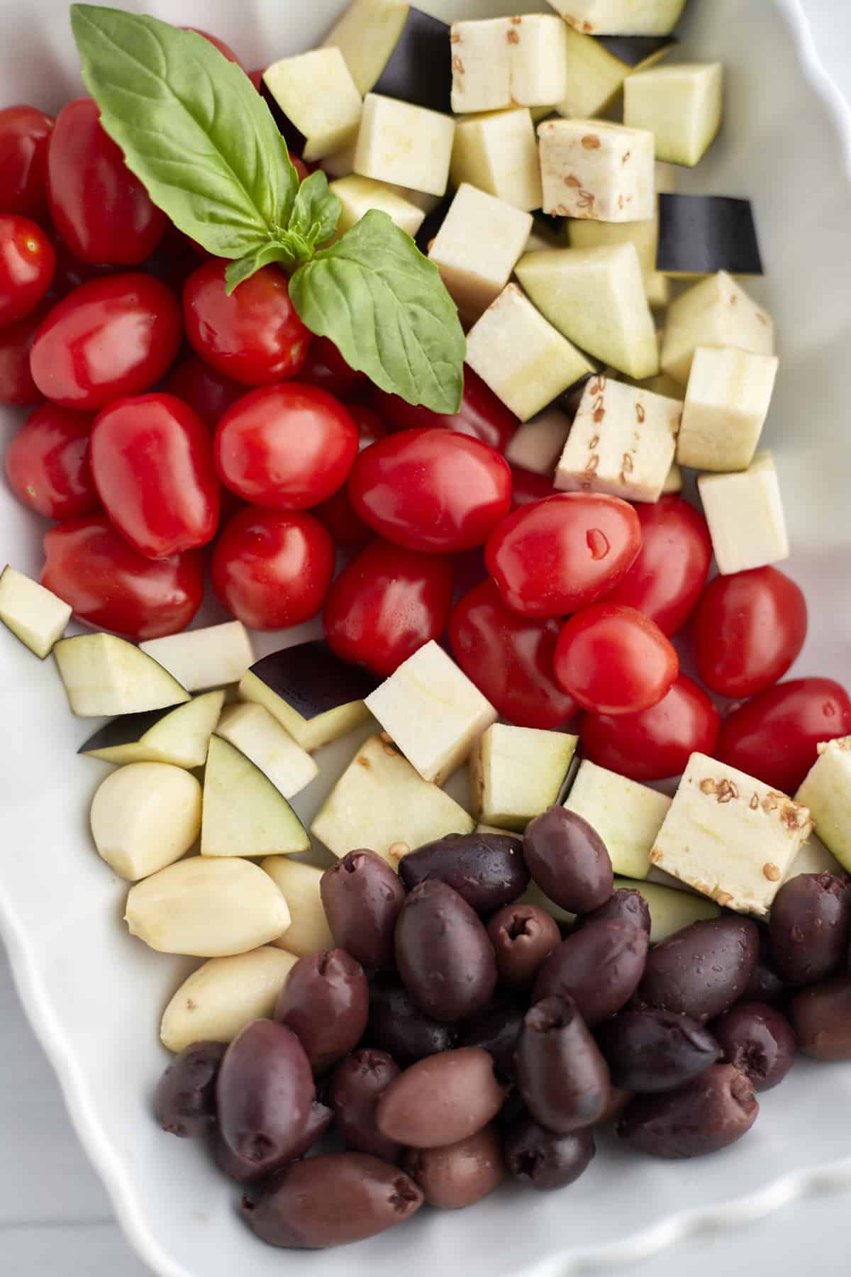 Baking dish of eggplant, tomatoes and olives