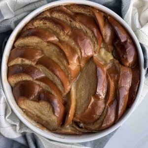 overhead image of a round baking dish full of salted caramel bread pudding