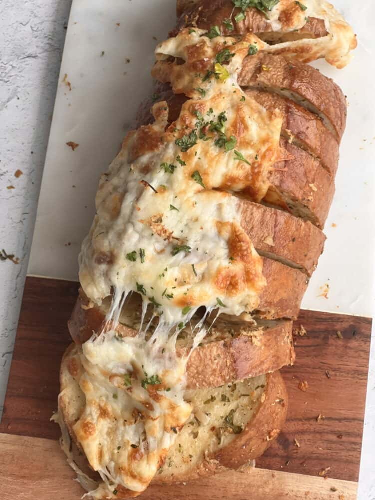 overhead image of a loaf of cheesy garlic bread 