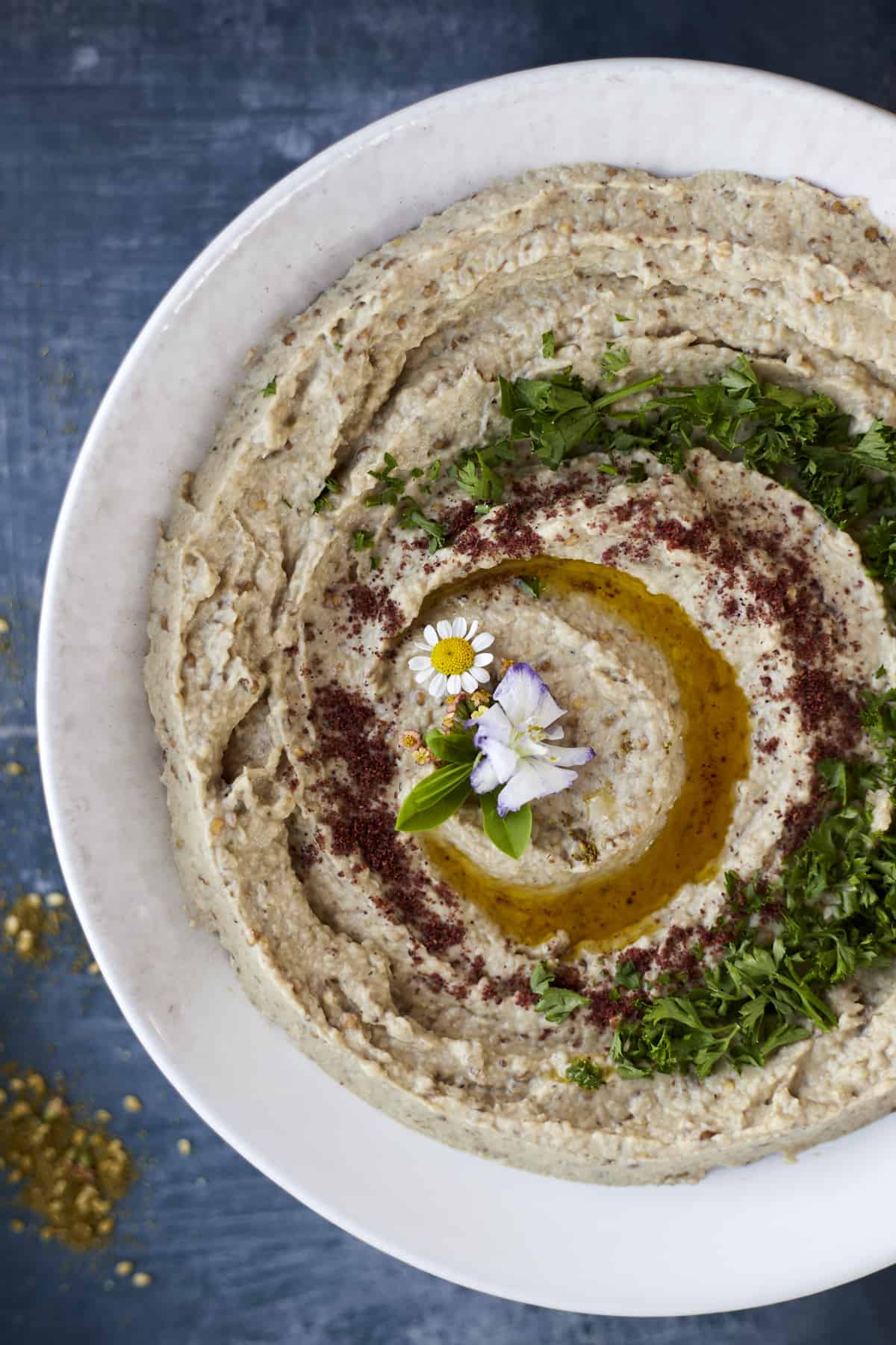Baba Ganoush plated with parsley and olive oil