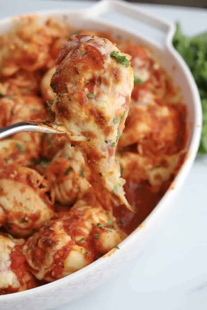 one cheesy garlic knot on a fork