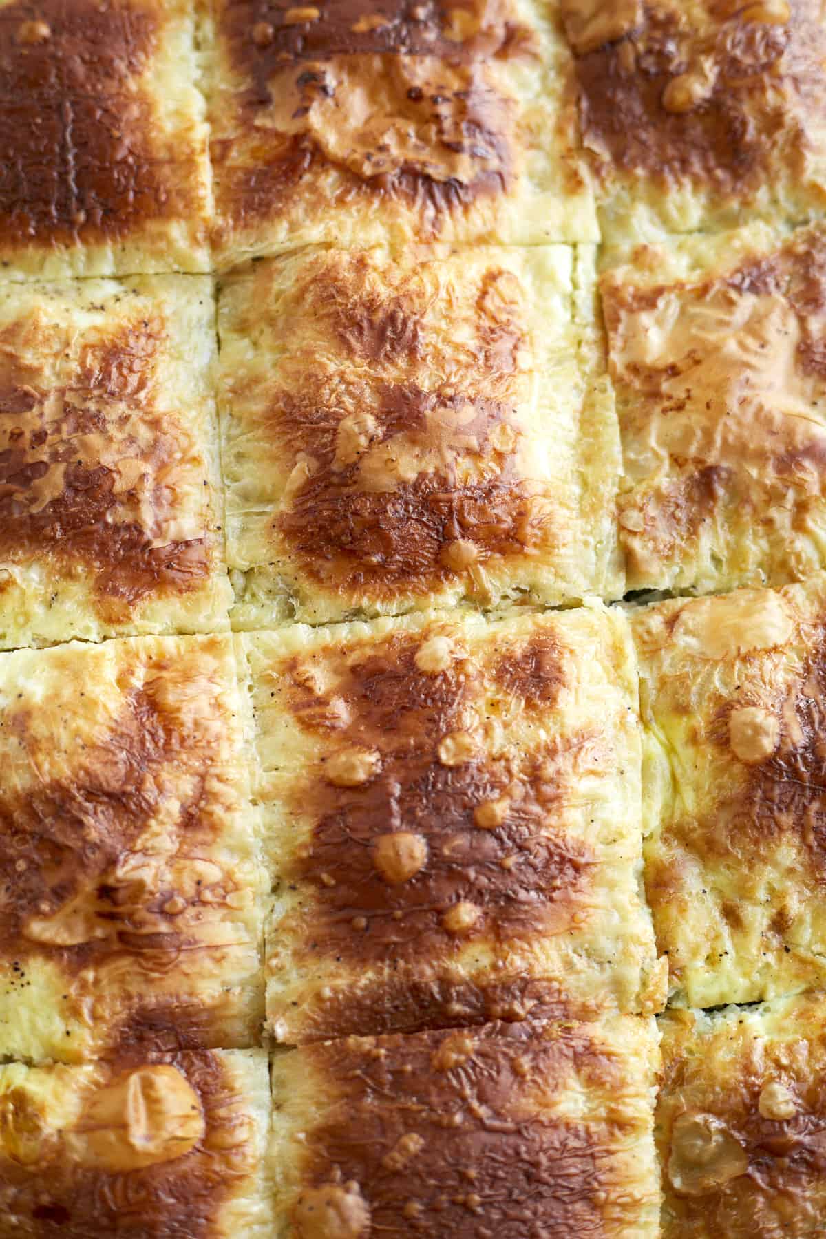 close up image of baked phyllo spinach pie 