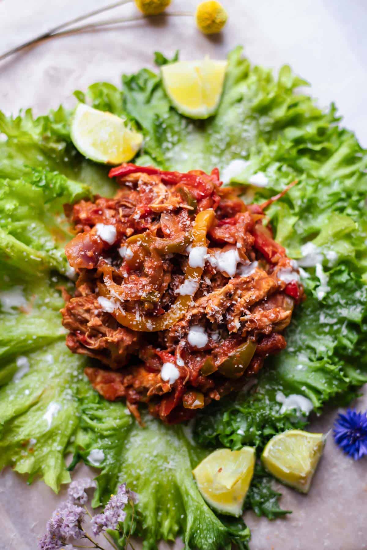 overhead image of Instant pot chicken fajita mix on a lettuce cup.