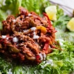 An Instant Pot chicken fajita mixture on a lettuce cup.