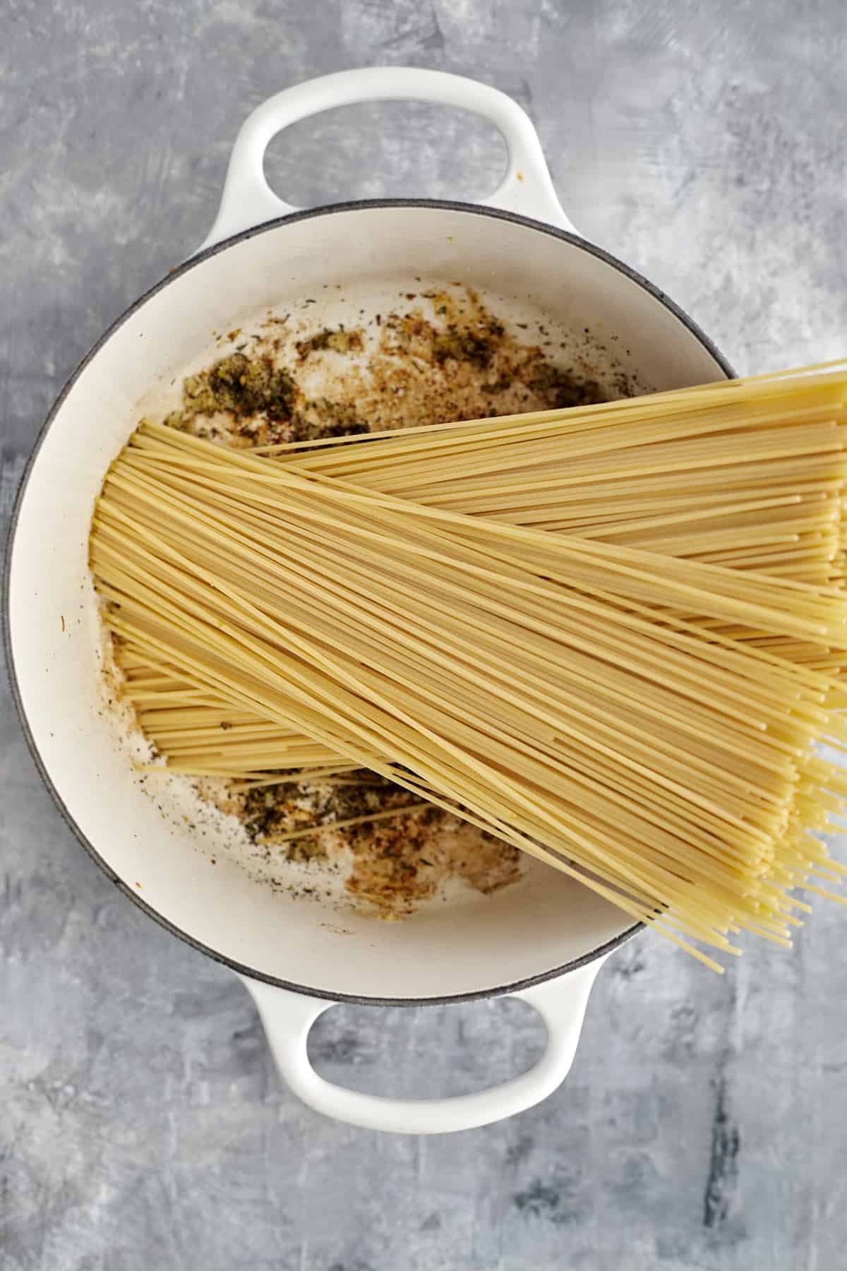 spaghetti noodles in a pot to make spaghetti carbonara
