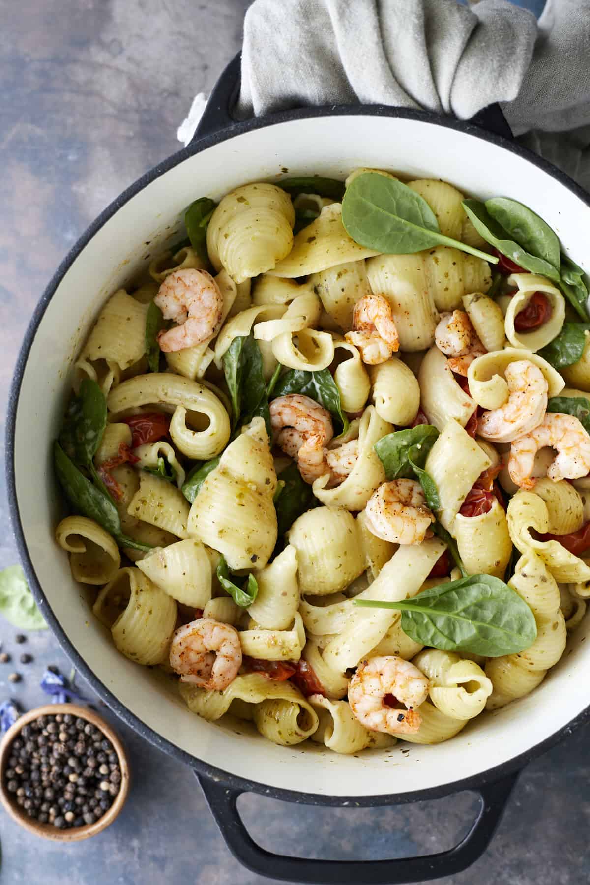 overhead image of one pot pesto pasta with oven baked shrimp