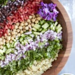 Overhead image of a Mediterranean quinoa salad in a bowl.