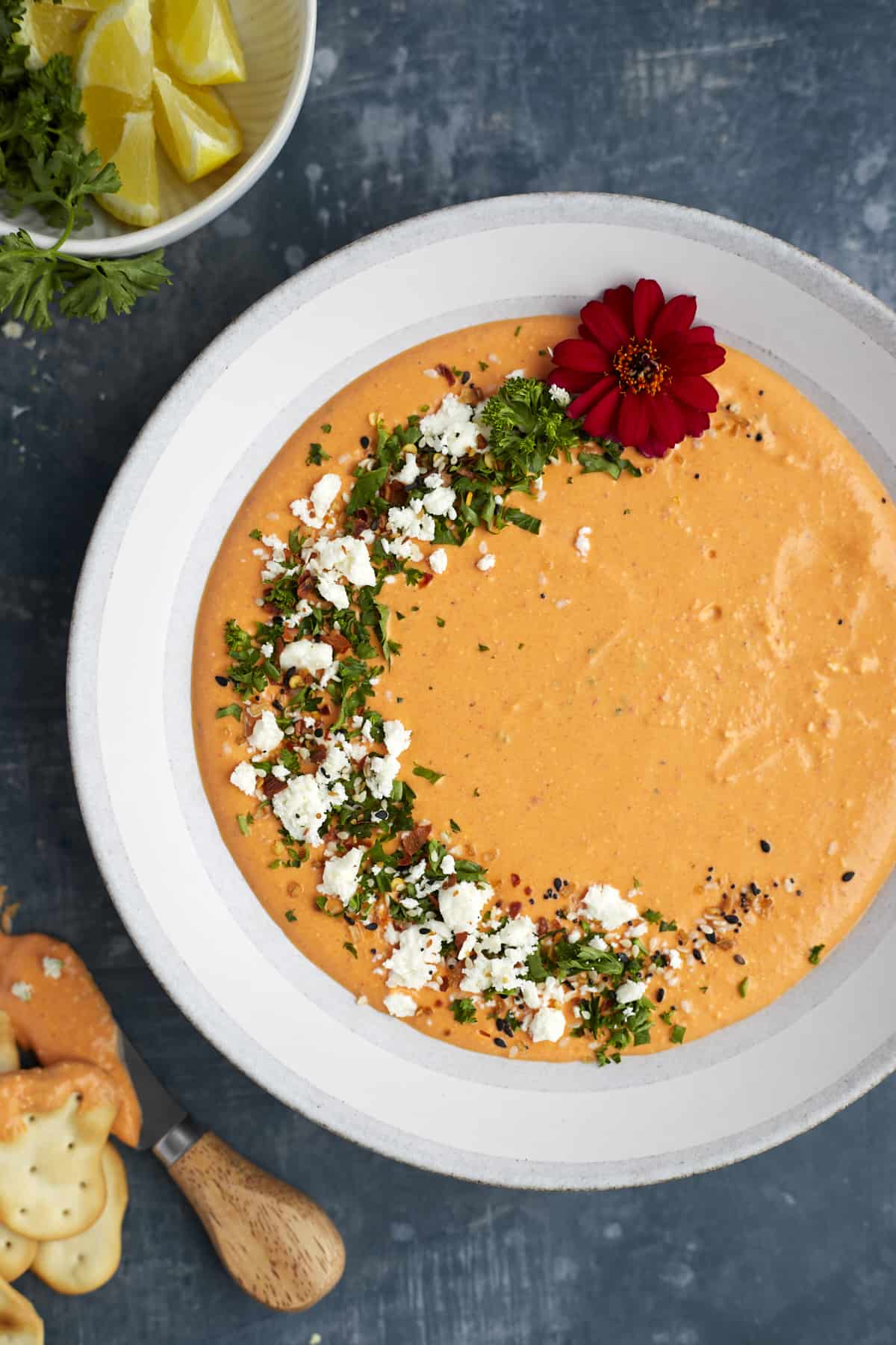 overhead image of a bowl of roasted red pepper whipped feta