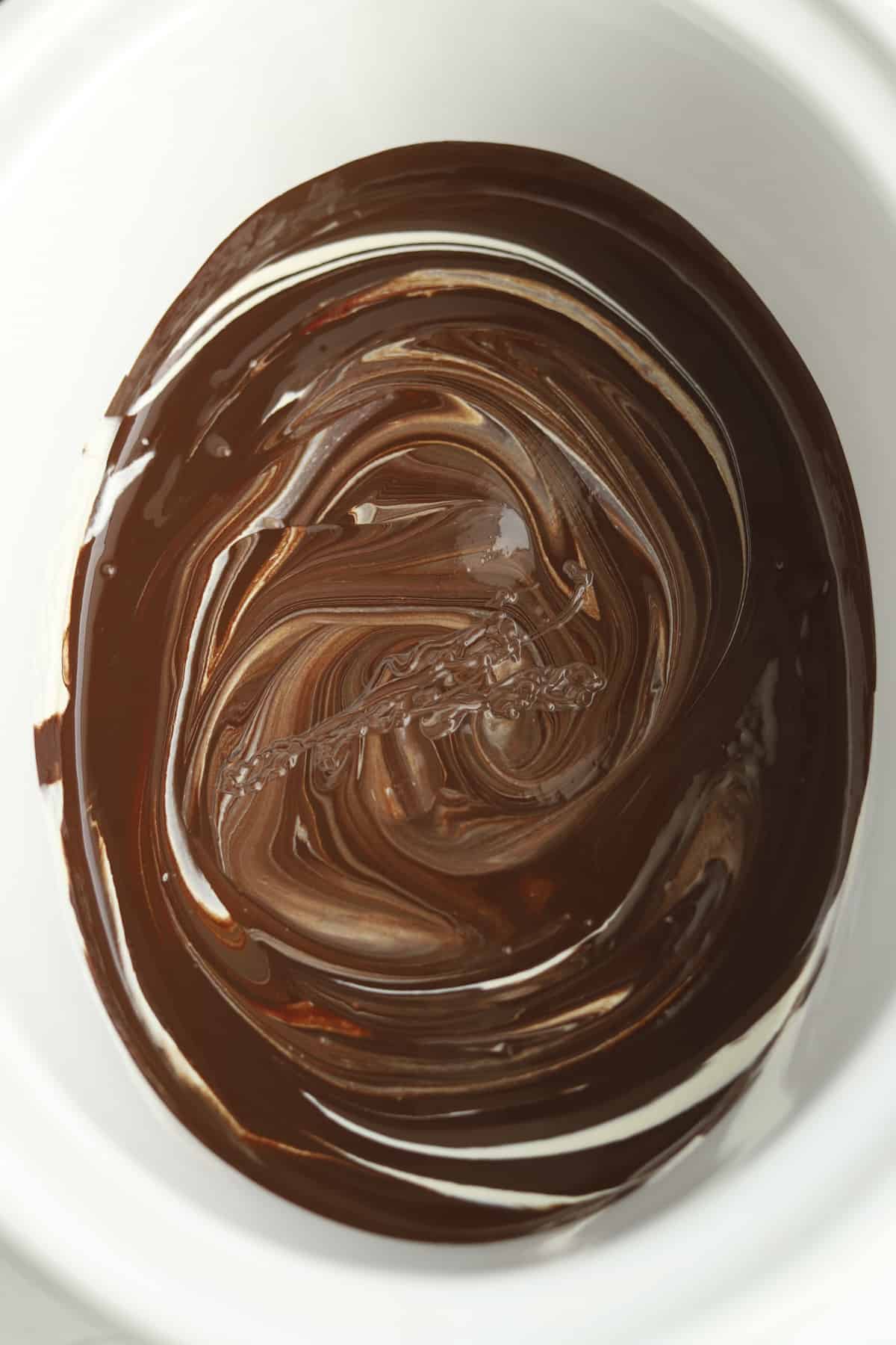 overhead of slow cooker with melted chocolates
