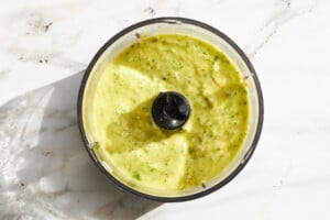 Green goddess dressing in a food processor.