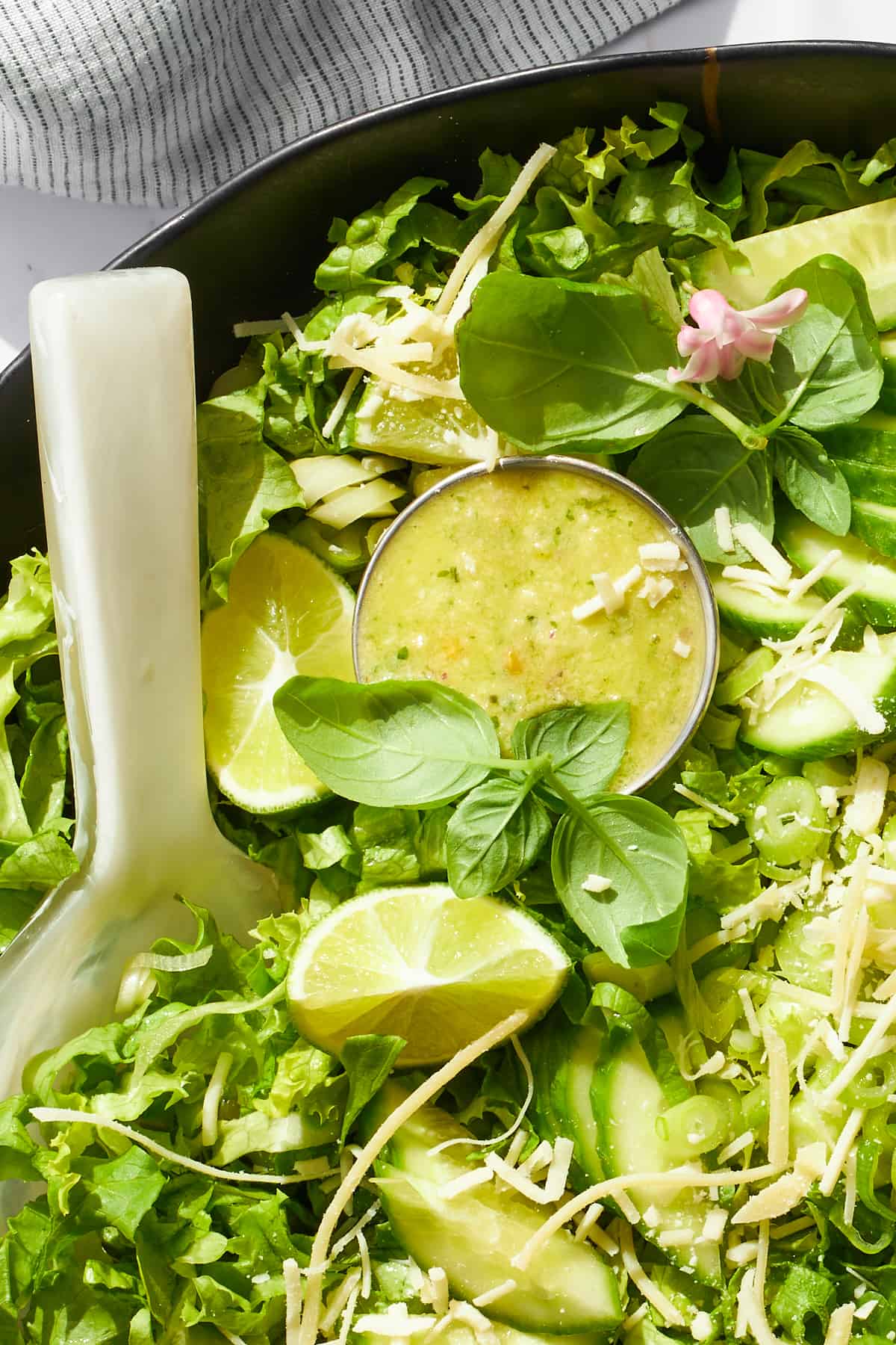 Green goddess dressing nestled on top of a salad. 