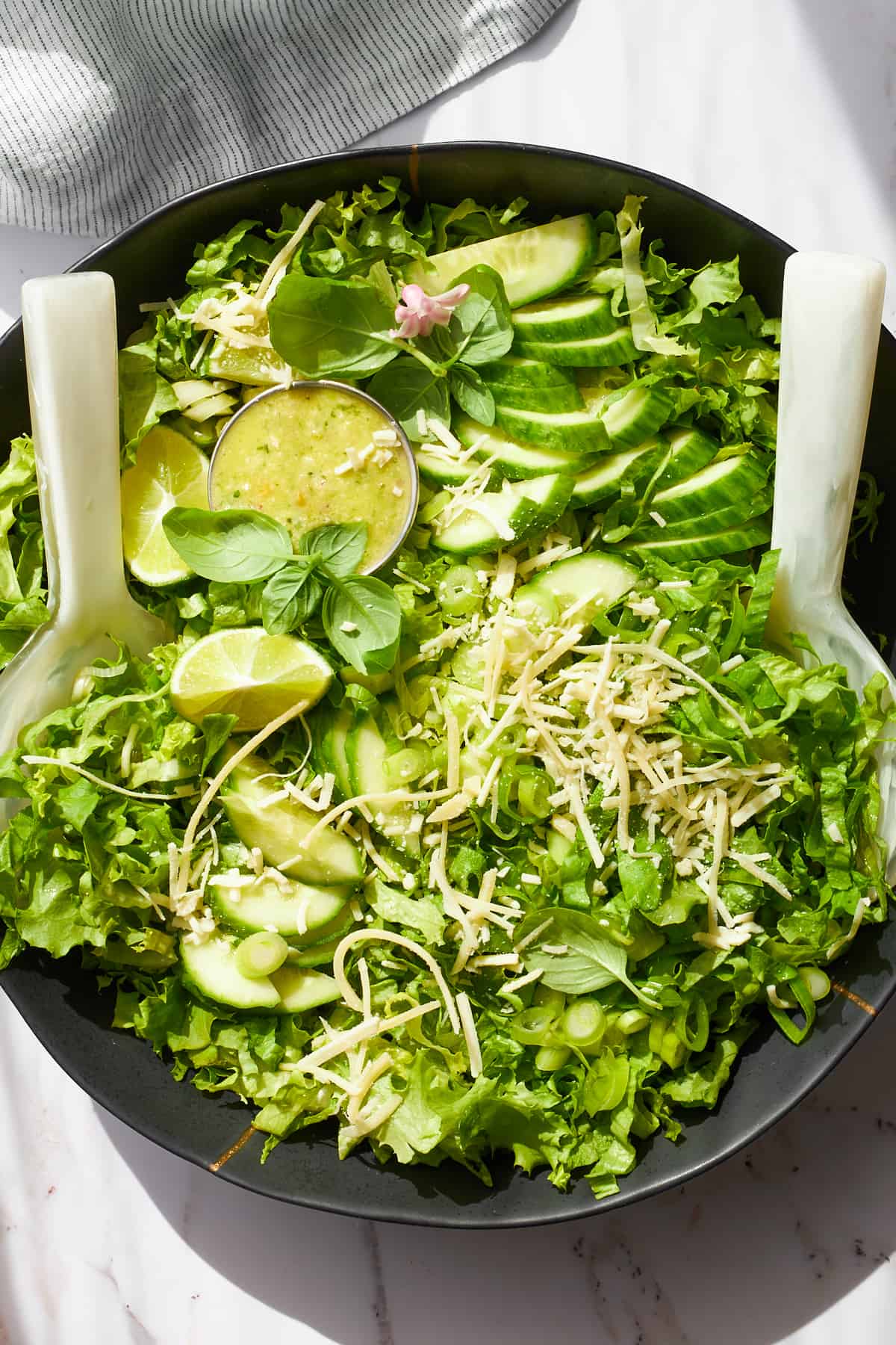 A bowl of green goddess salad. 