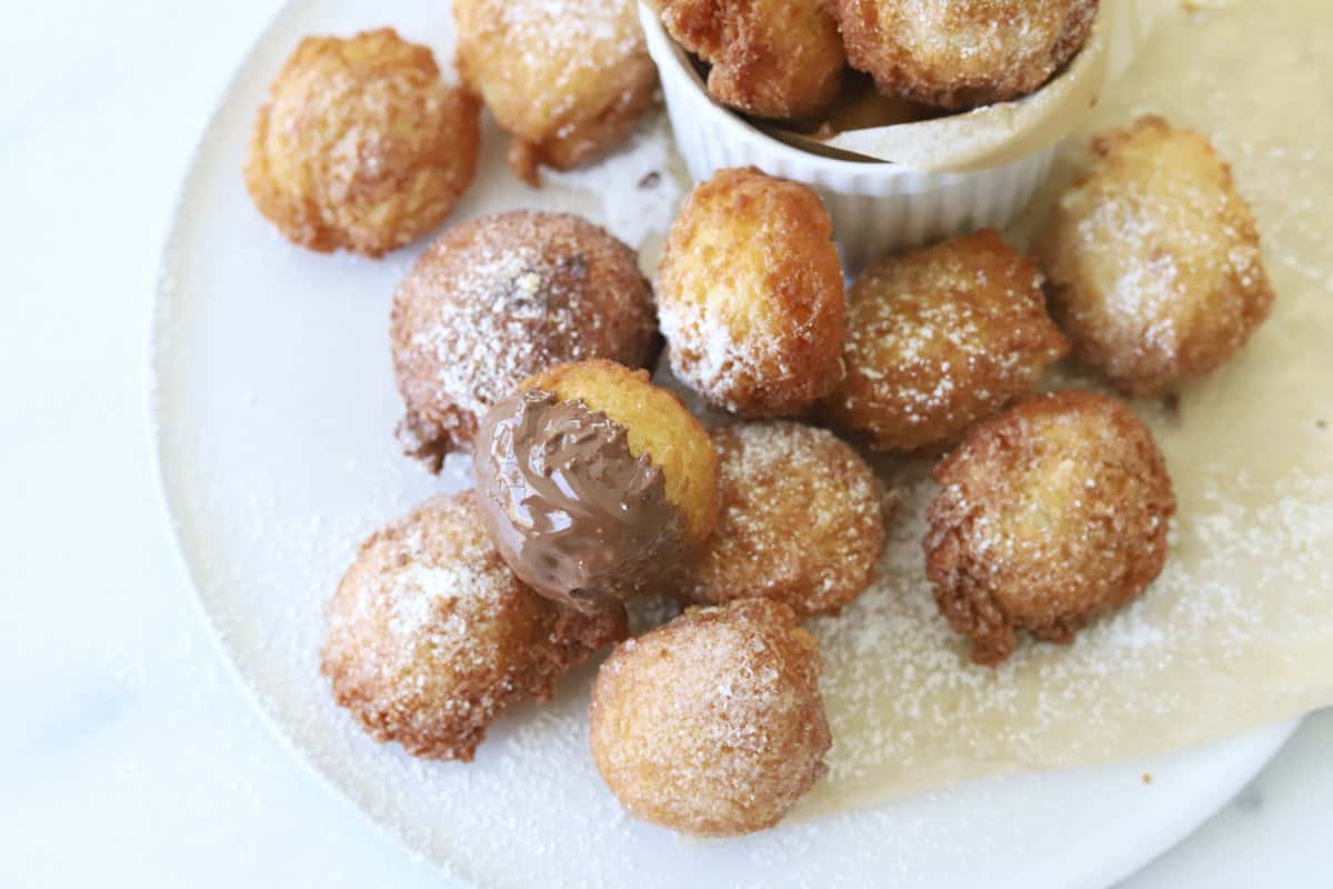 Zeppole with powdered sugar and Nutella.