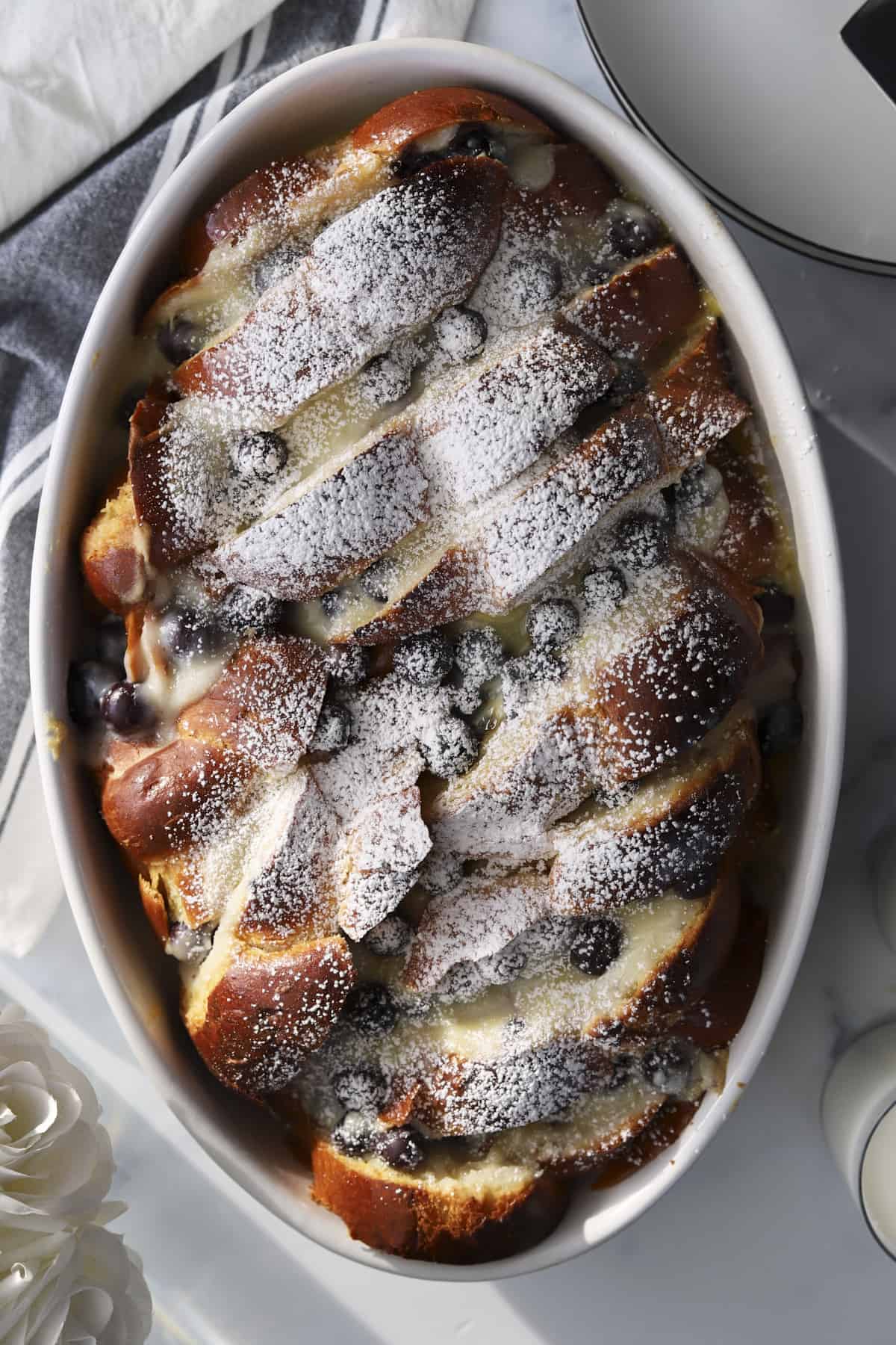 overhead blueberry mascarpone french toast baking dish with powdered sugar