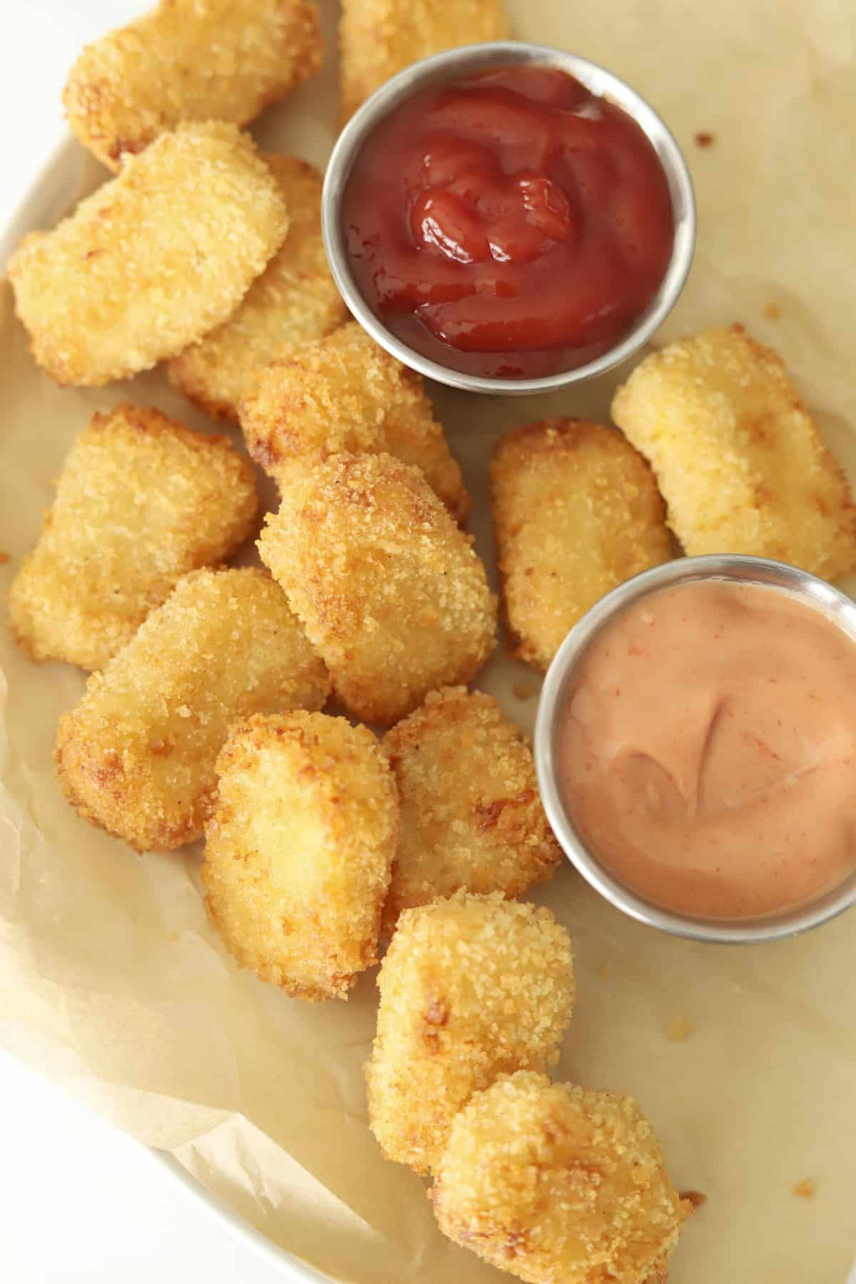 overhead of potato nuggets with ketchup