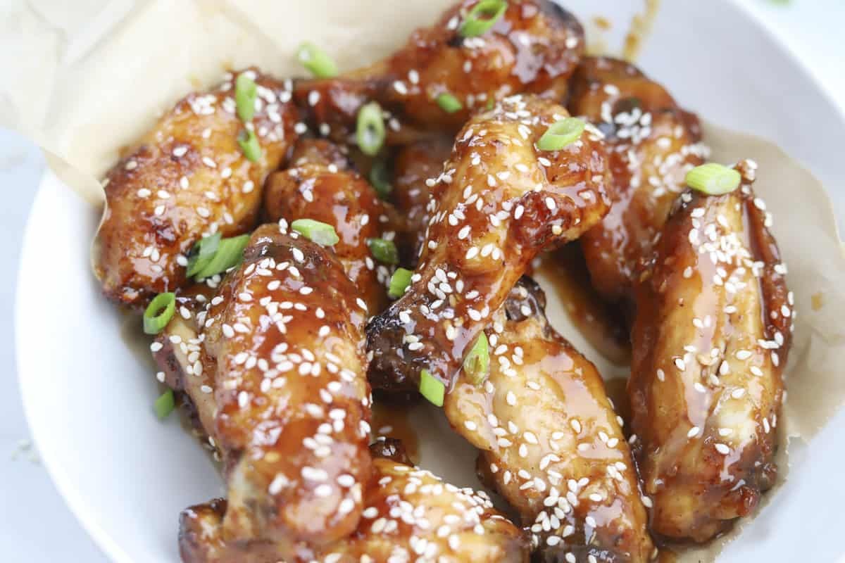 air fryer honey garlic chicken wings topped with sesame seeds