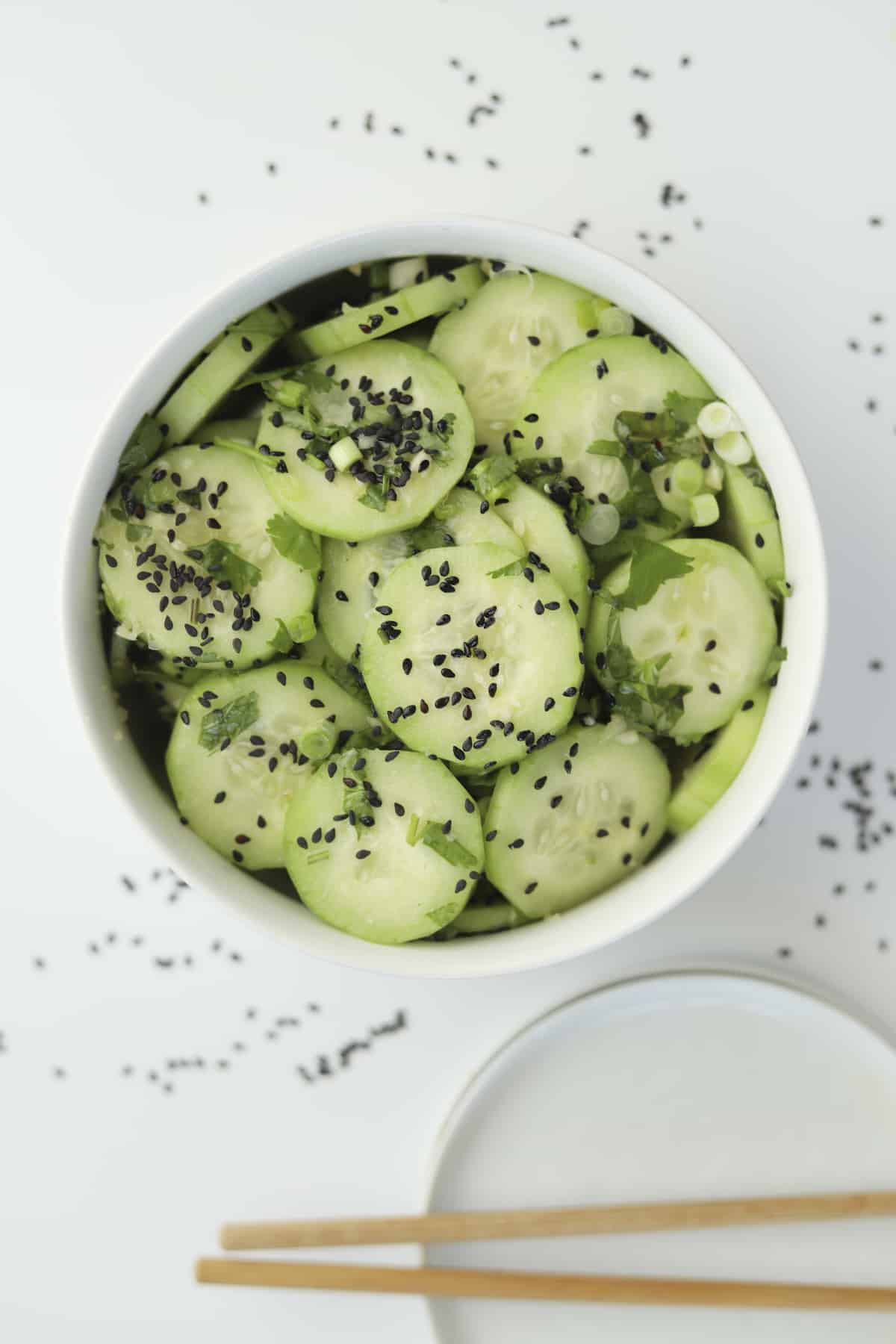 overhead with black sesame seeds and chopsticks.