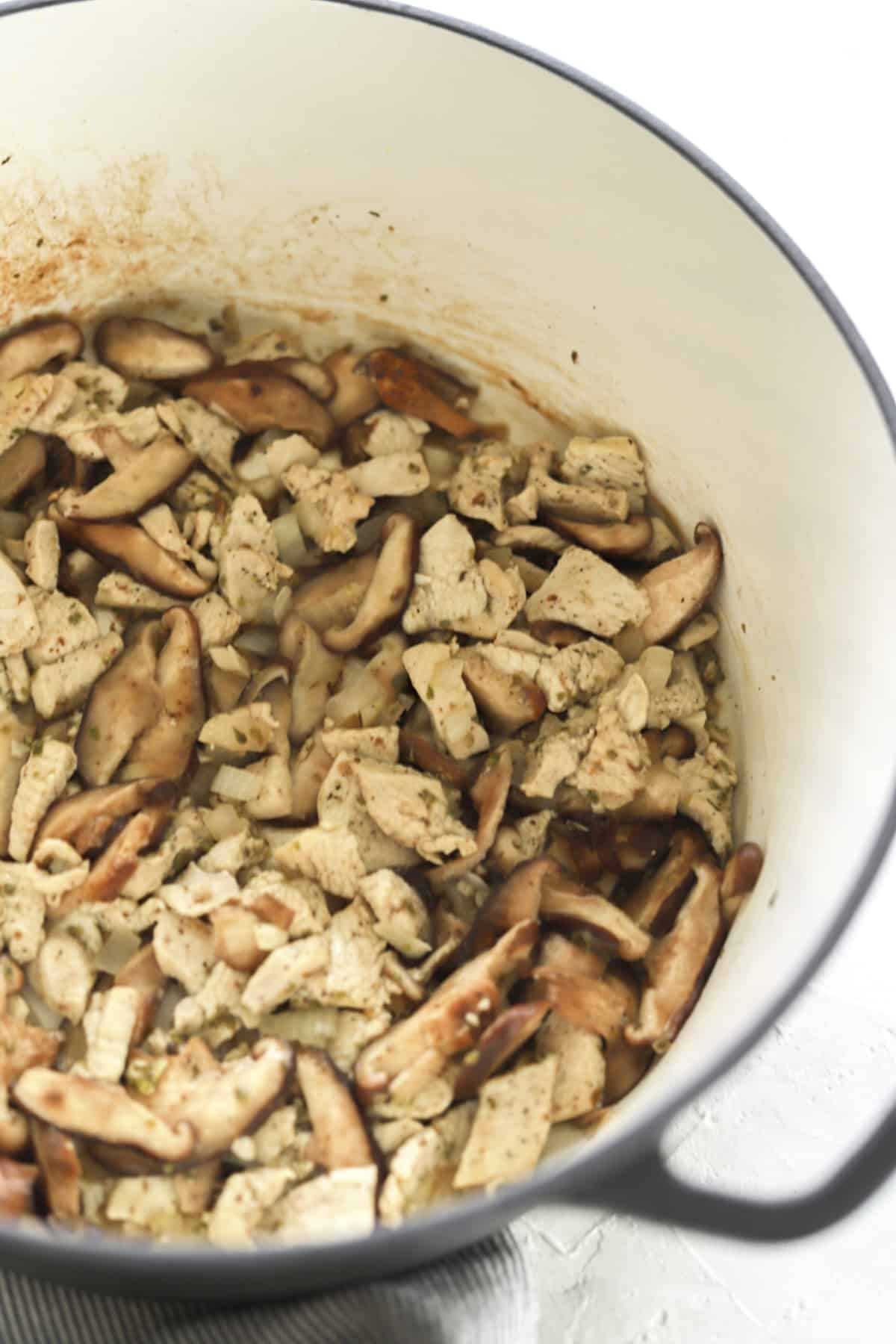 pot of sautéed mushrooms and chicken