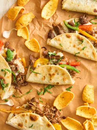 A group of tacos on a paper.