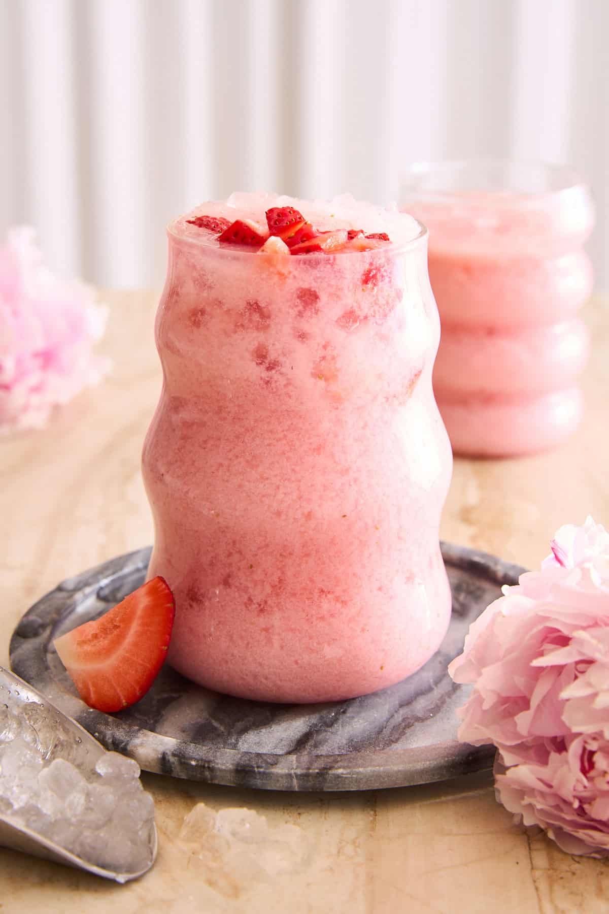 glasses of creamy strawberry agua fresca with condensed milk