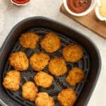 Chicken nuggets in an air fryer.