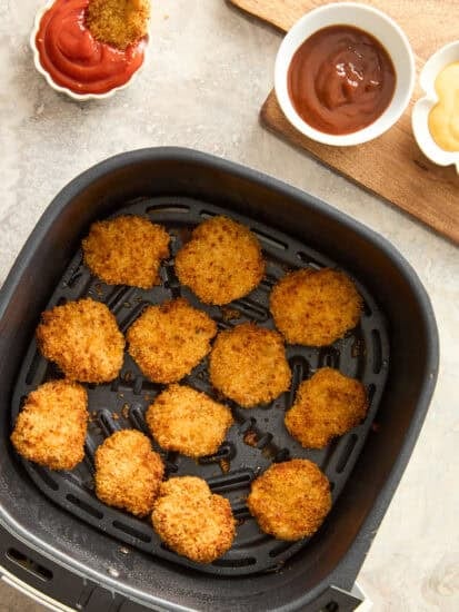 Chicken nuggets in an air fryer.