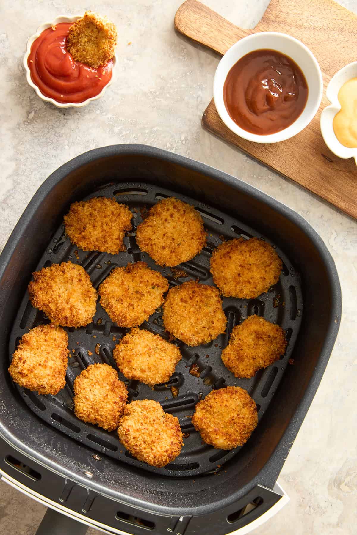 Chicken nuggets in an air fryer.