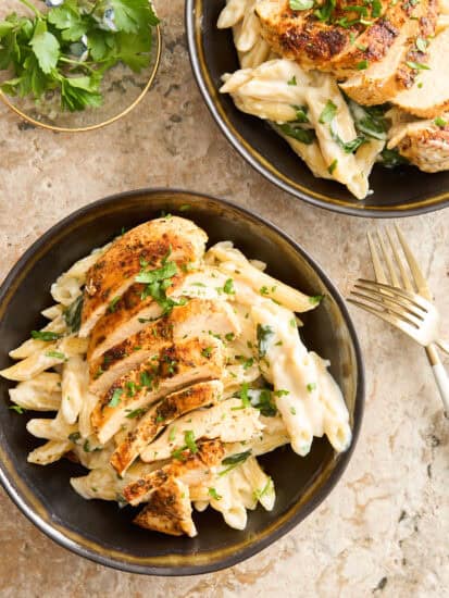 A bowl of cottage cheese pasta topped with chicken.