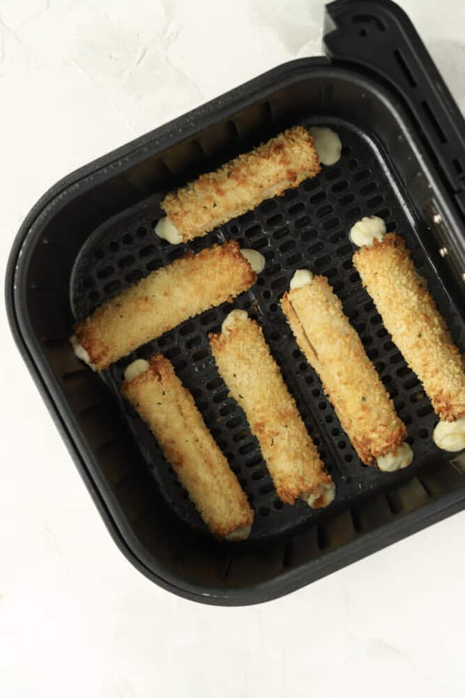 cooked cheese sticks in an air fryer