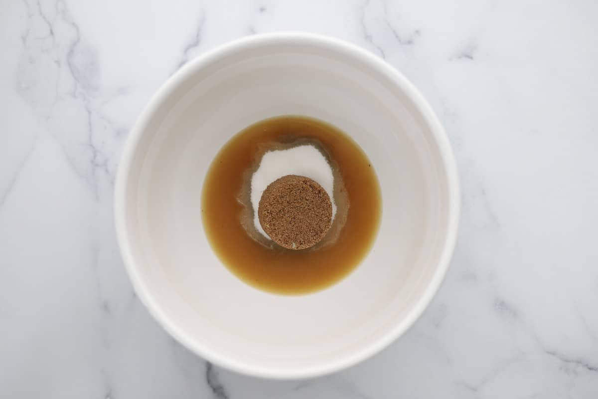 Melted browned butter, granulated sugar, and brown sugar in a bowl.
