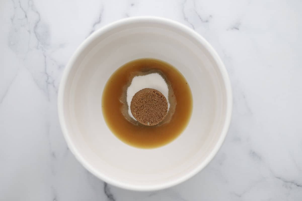 Melted browned butter, granulated sugar, and brown sugar in a bowl. 