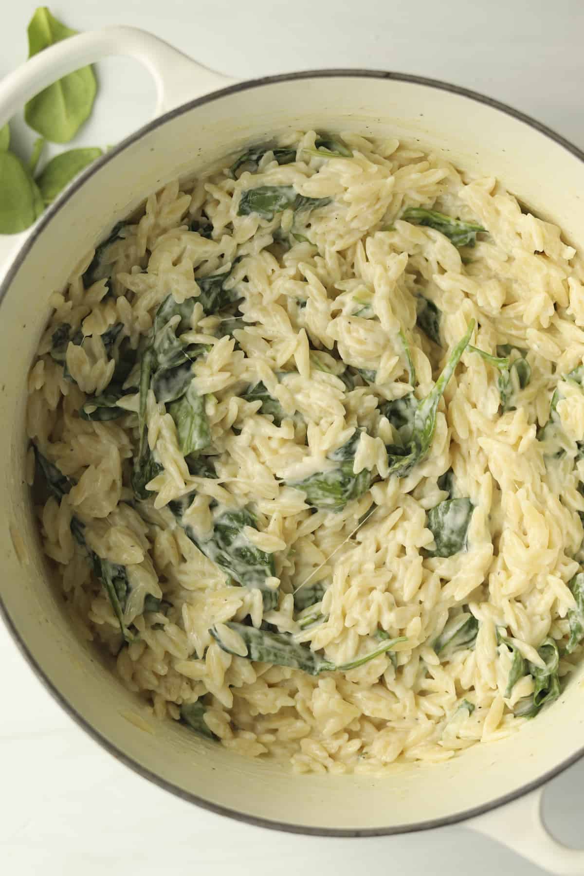 overhead pot of creamy orzo pasta