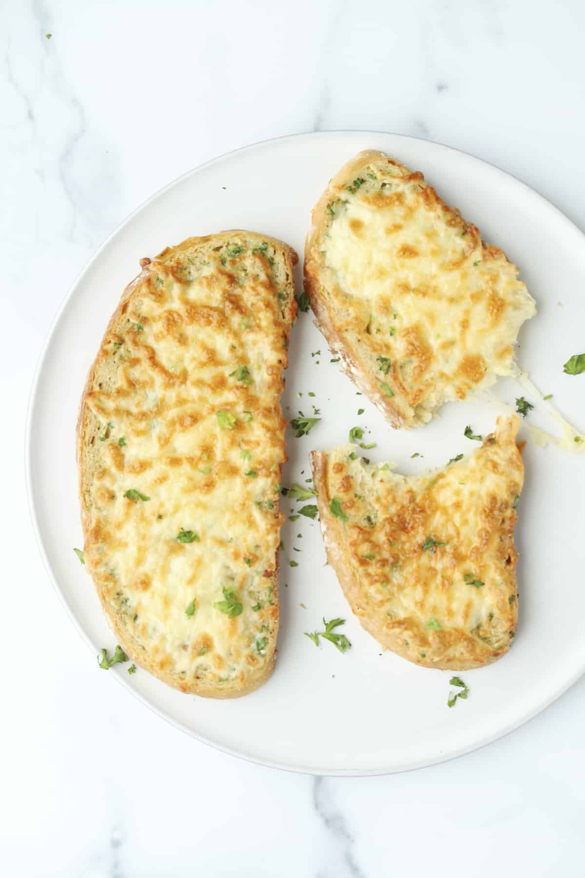 overhead of 2 pieces of cheese garlic toast