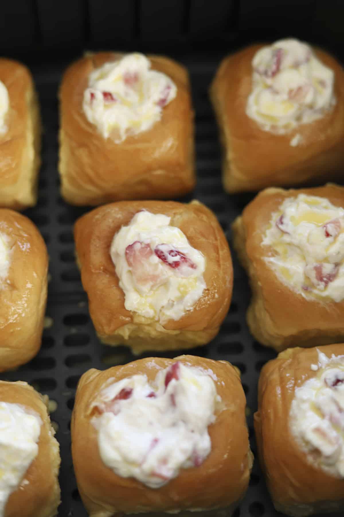 strawberry cream cheese stuffed Hawaiian rolls in an air fryer