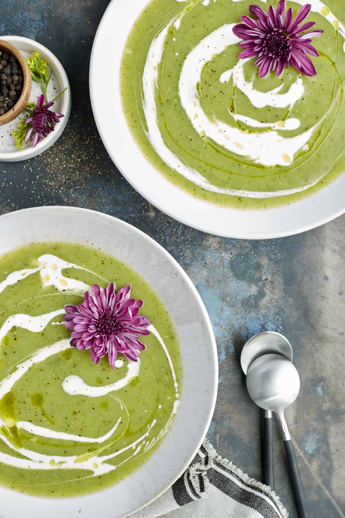 two bowls of zucchini soup