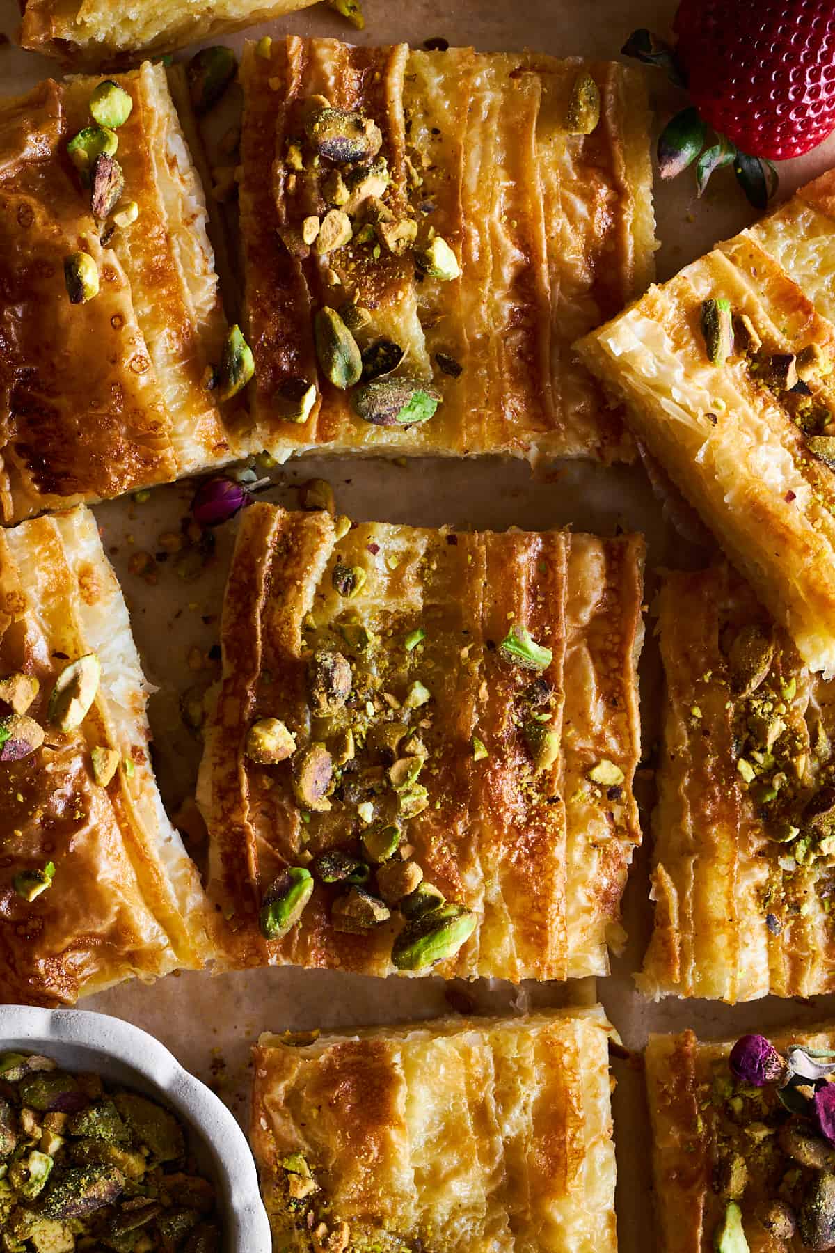 Squares of crinkle phyllo topped with pistachios.