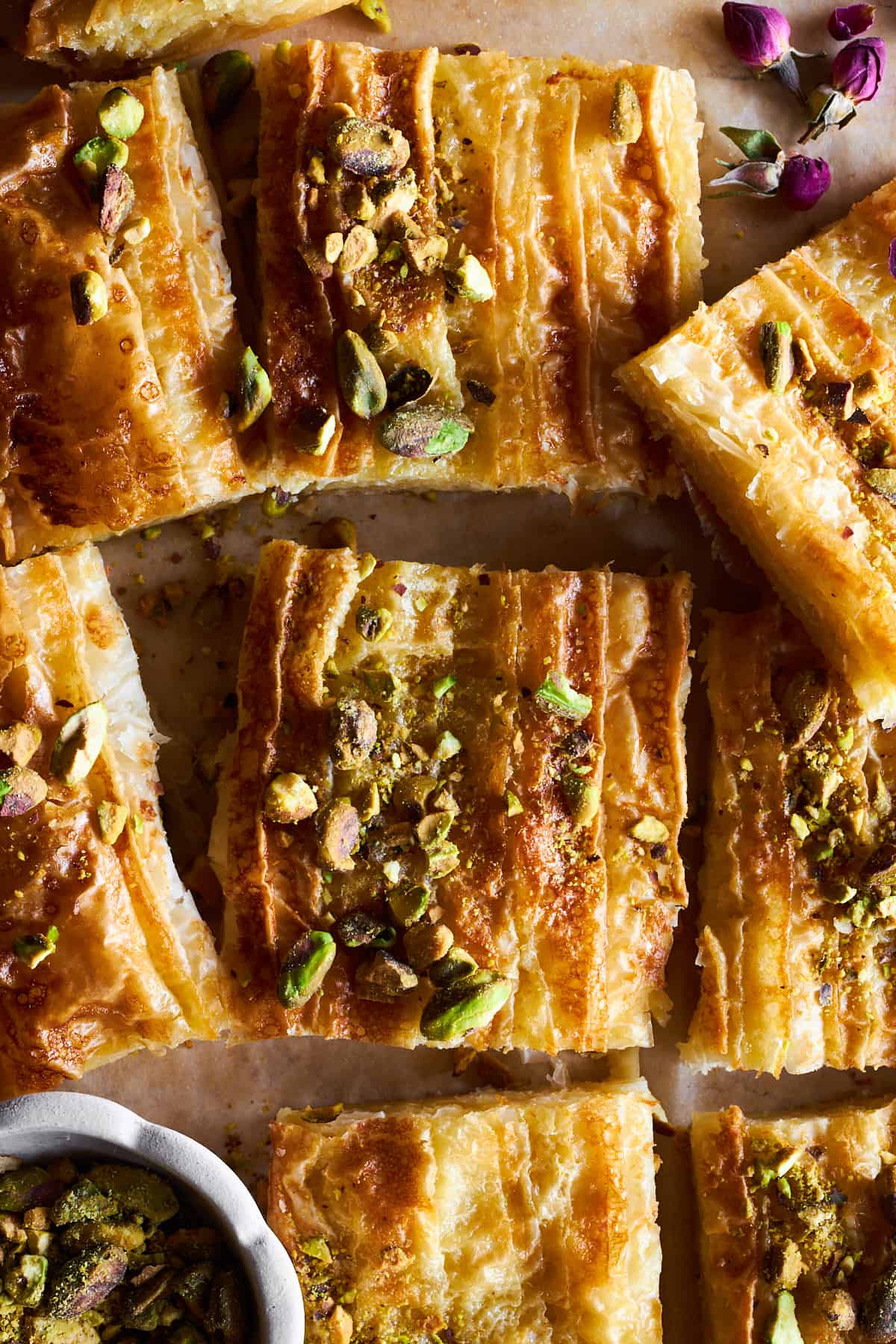 Squares of crinkle phyllo topped with pistachios.