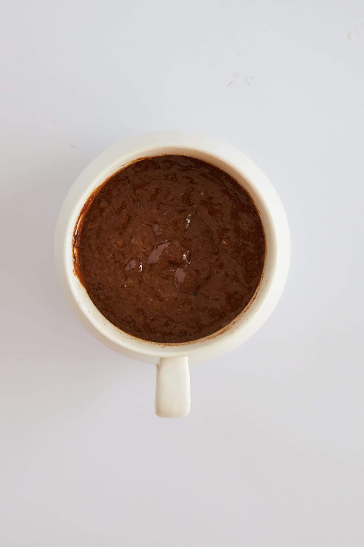 Overhead image of a cooked chocolate mug cake.