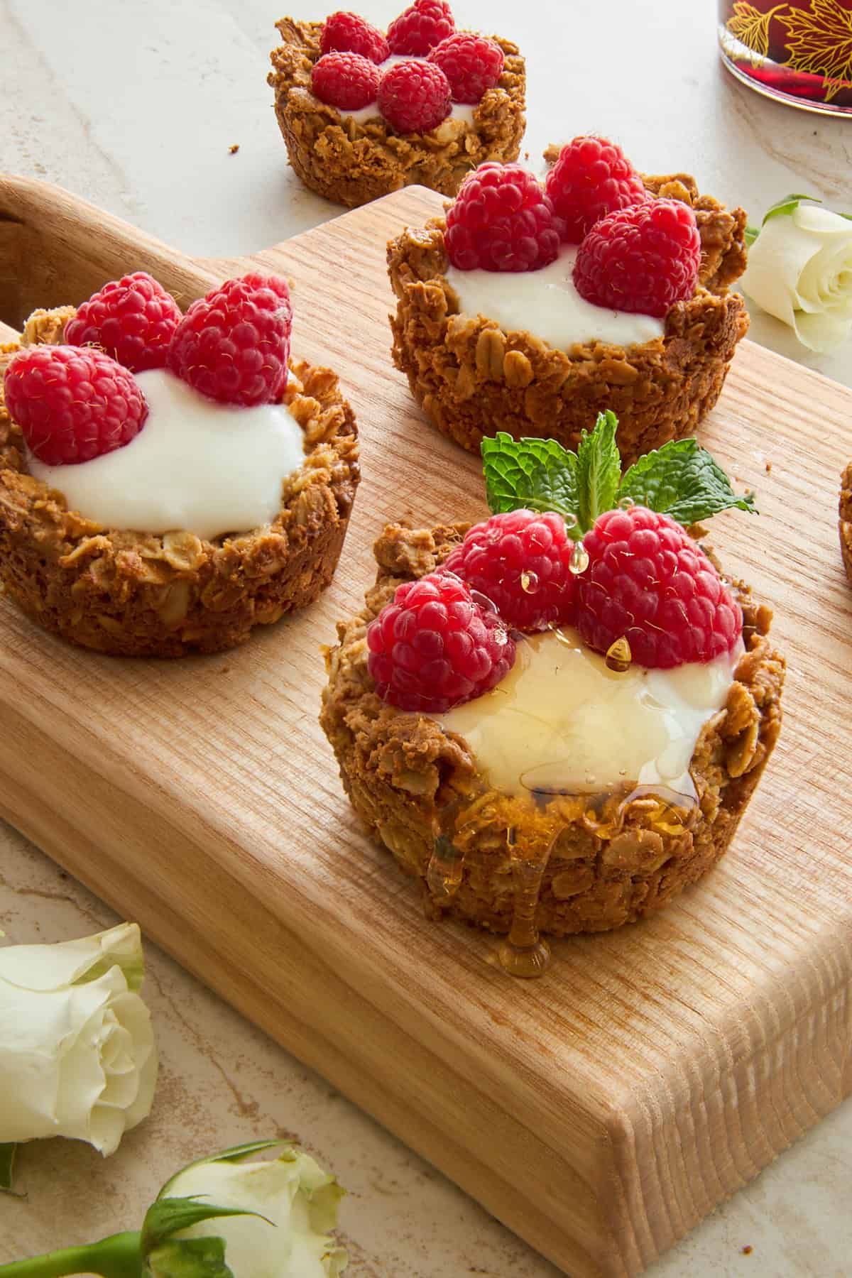 Granola cups full of yogurt and fresh berries.