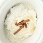 rice, coconut milk, sugar, vanilla, and cinnamon sticks in a slow cooker