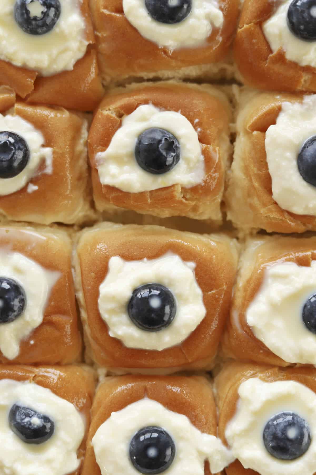 close up image of rolls of lemon blueberry french toast with ricotta
