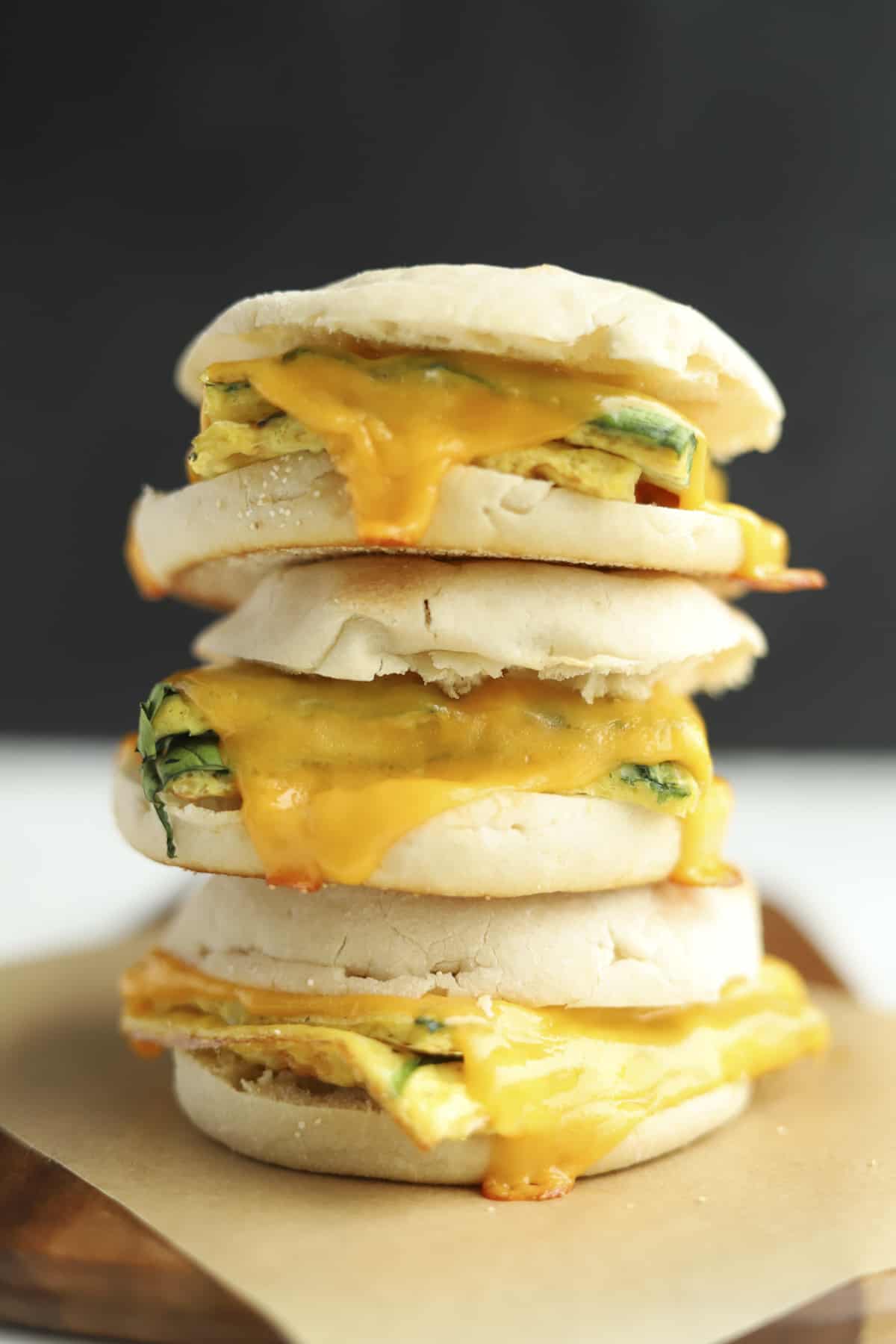 Three protein packed egg muffin sandwiches stacked on top of each other. 