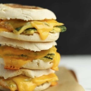 a stack of three protein packed egg muffin sandwiches on top of each other
