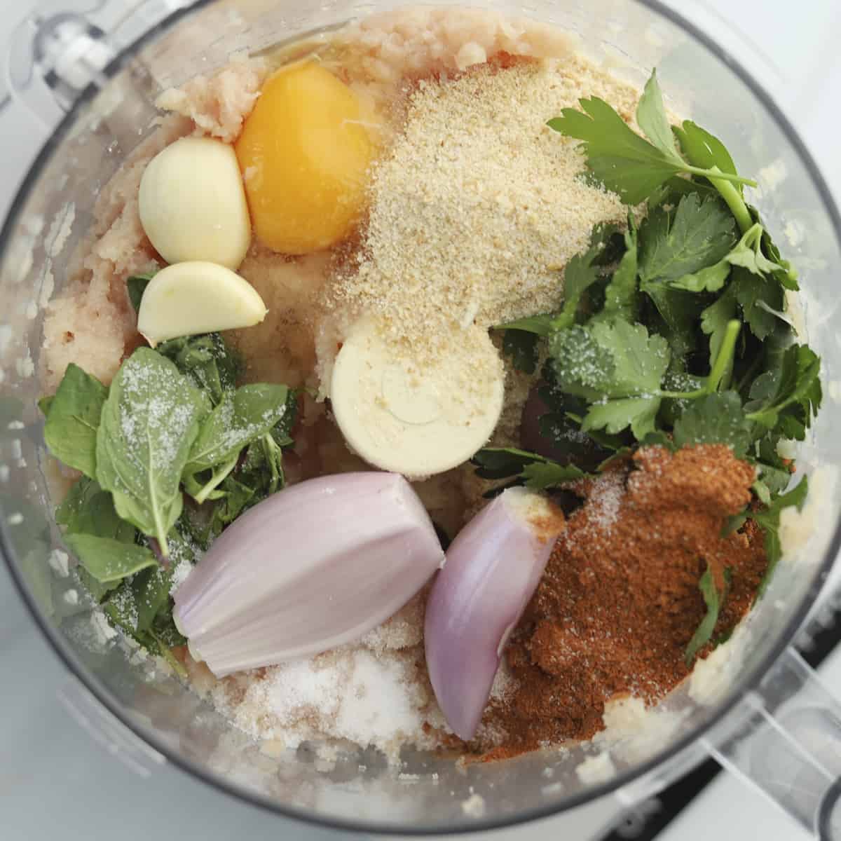 egg, fresh herbs, red onion, breadcrumbs, ground chicken, etc. in a food processor to make chicken kofta.