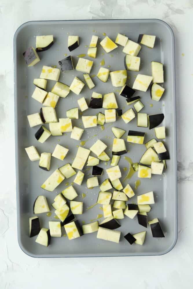 cubes of eggplant on a baking sheet