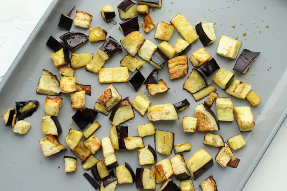 roasted eggplant on a baking sheet for a roasted eggplant salad