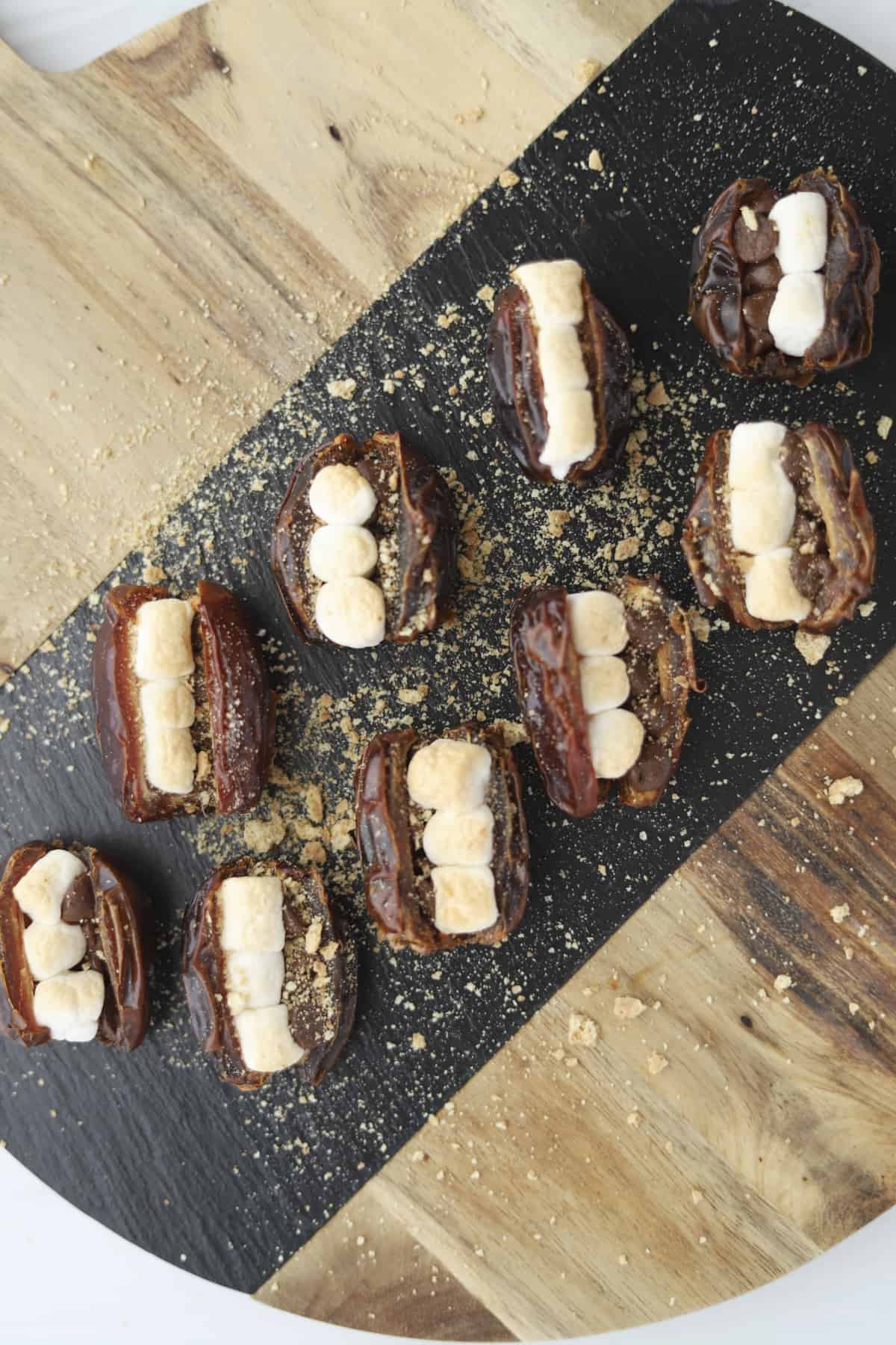 a board full of s'mores stuffed dates