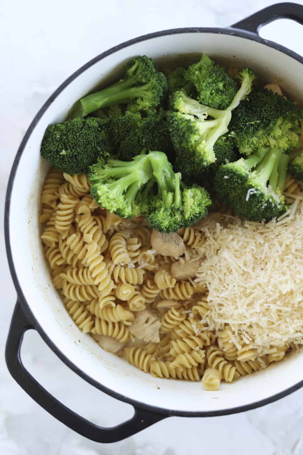 pot of rotini, chicken, broccoli and parmesan cheese