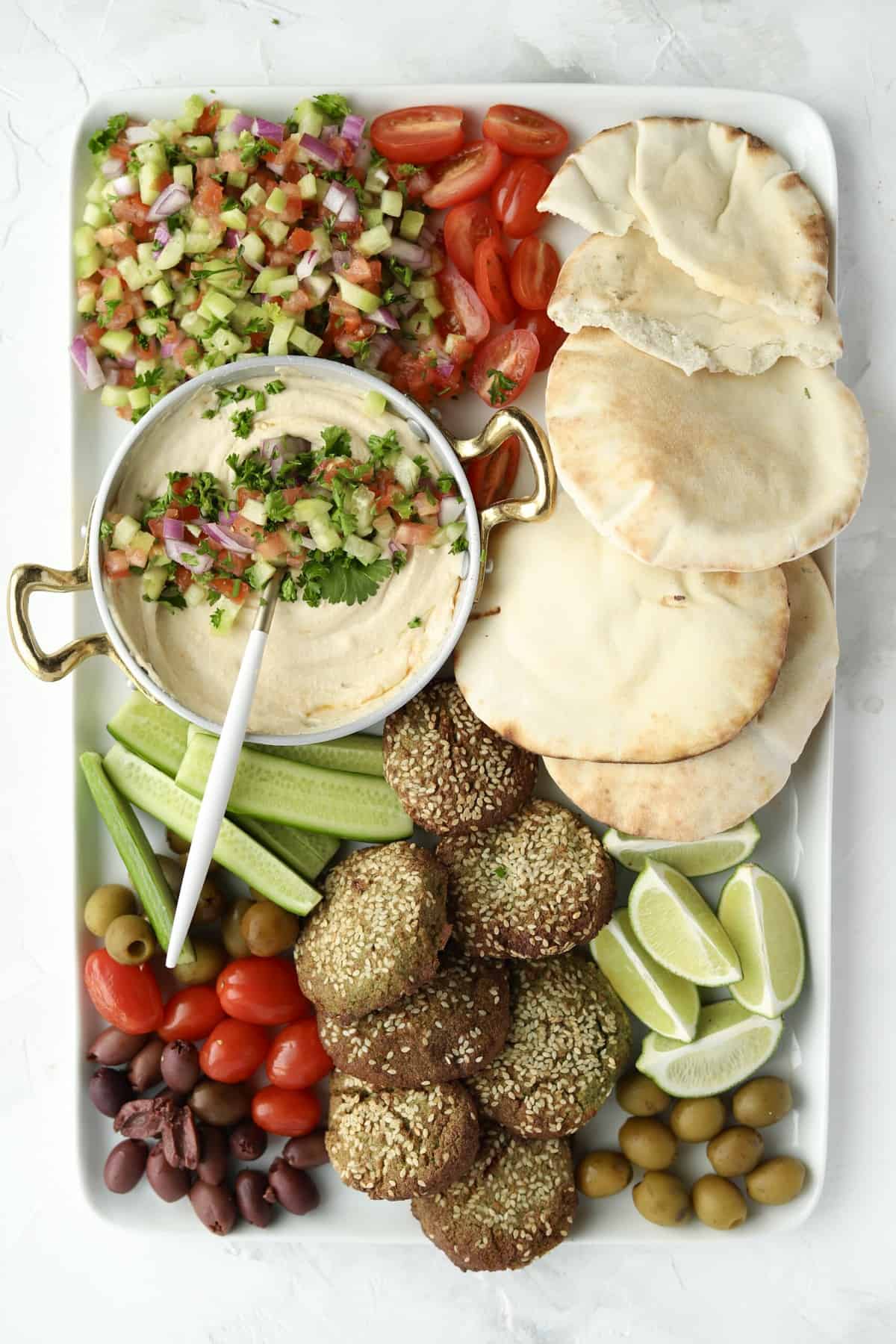 tray of falafel, hummus, and fixings
