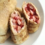 opened stuffed chimichanga with fresh strawberries